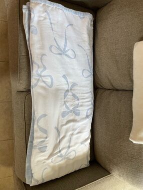 cupcakes & cashmere White and Light Blue Bow Print Throw Blanket